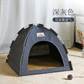 Cat resting inside grey pop-up tent bed